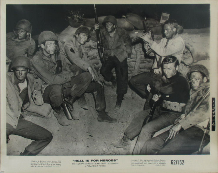 The Cast pose in a foxhole.